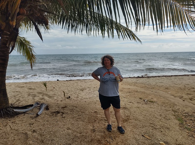 Happy
        Jayne standing on the beach.