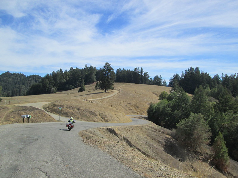 a motorcycle on a winding,
        remote road