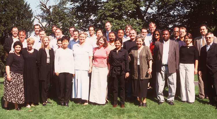 participants pose for a photo on a sunny day on a green lawn in Germany